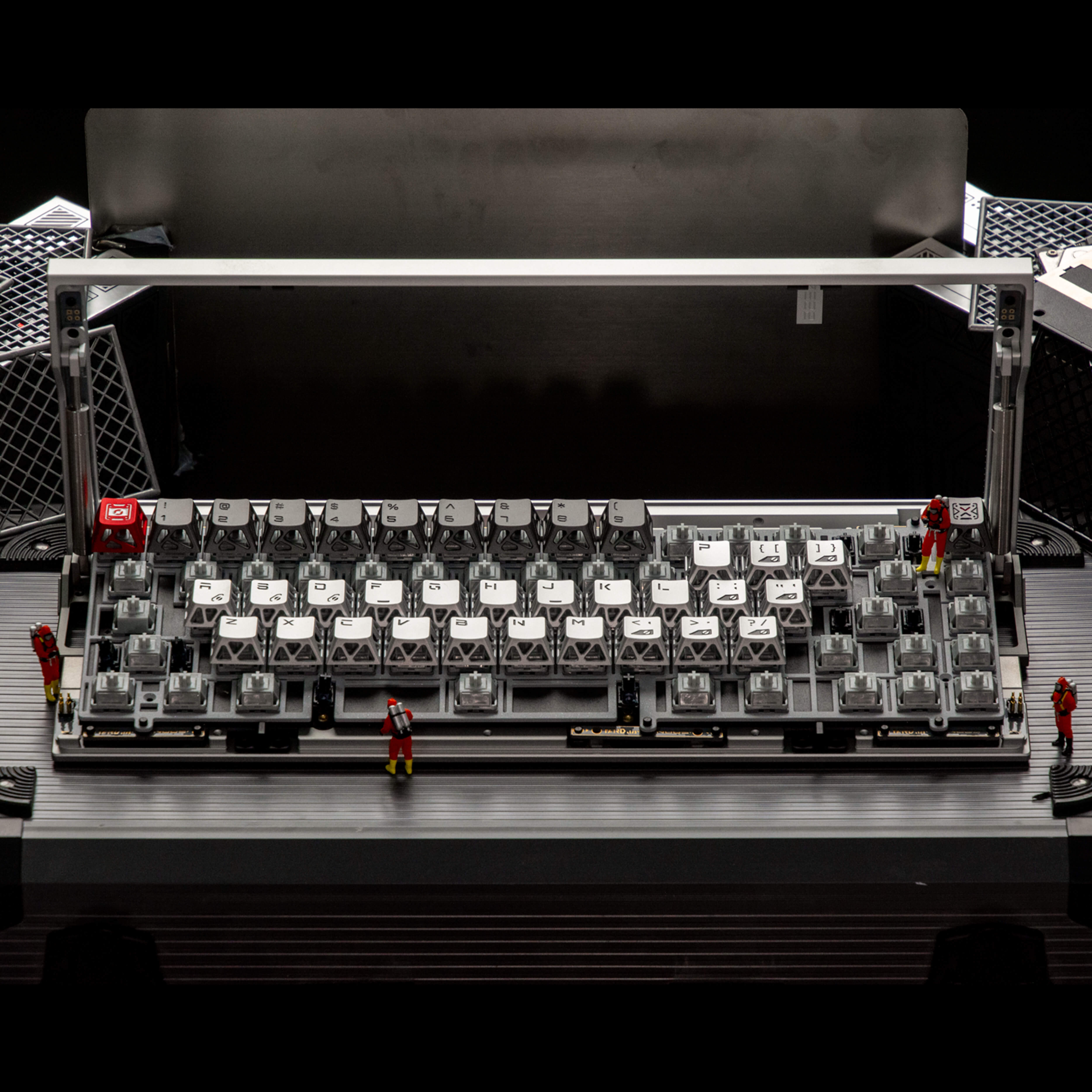 Full-sized mechanical keyboard made of interlocking plastic bricks on a black background